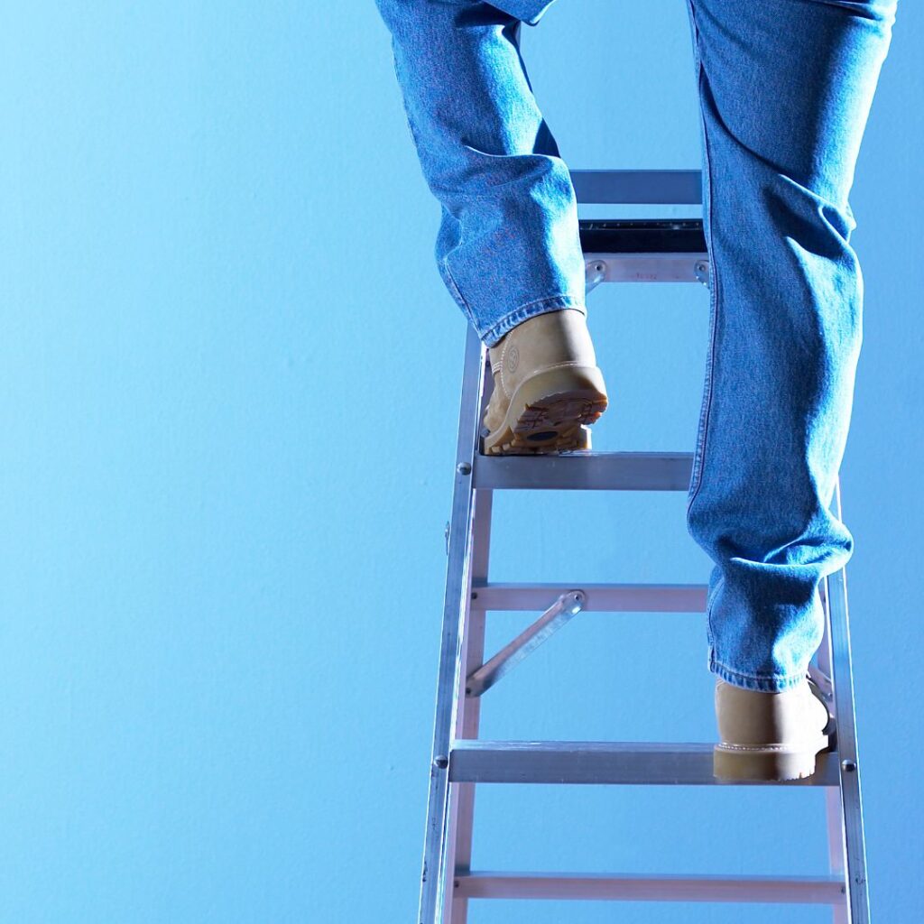 Man Climbing Ladder